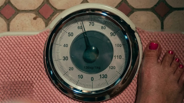 A bathroom scale in a dramatized scene in A Child of My Own