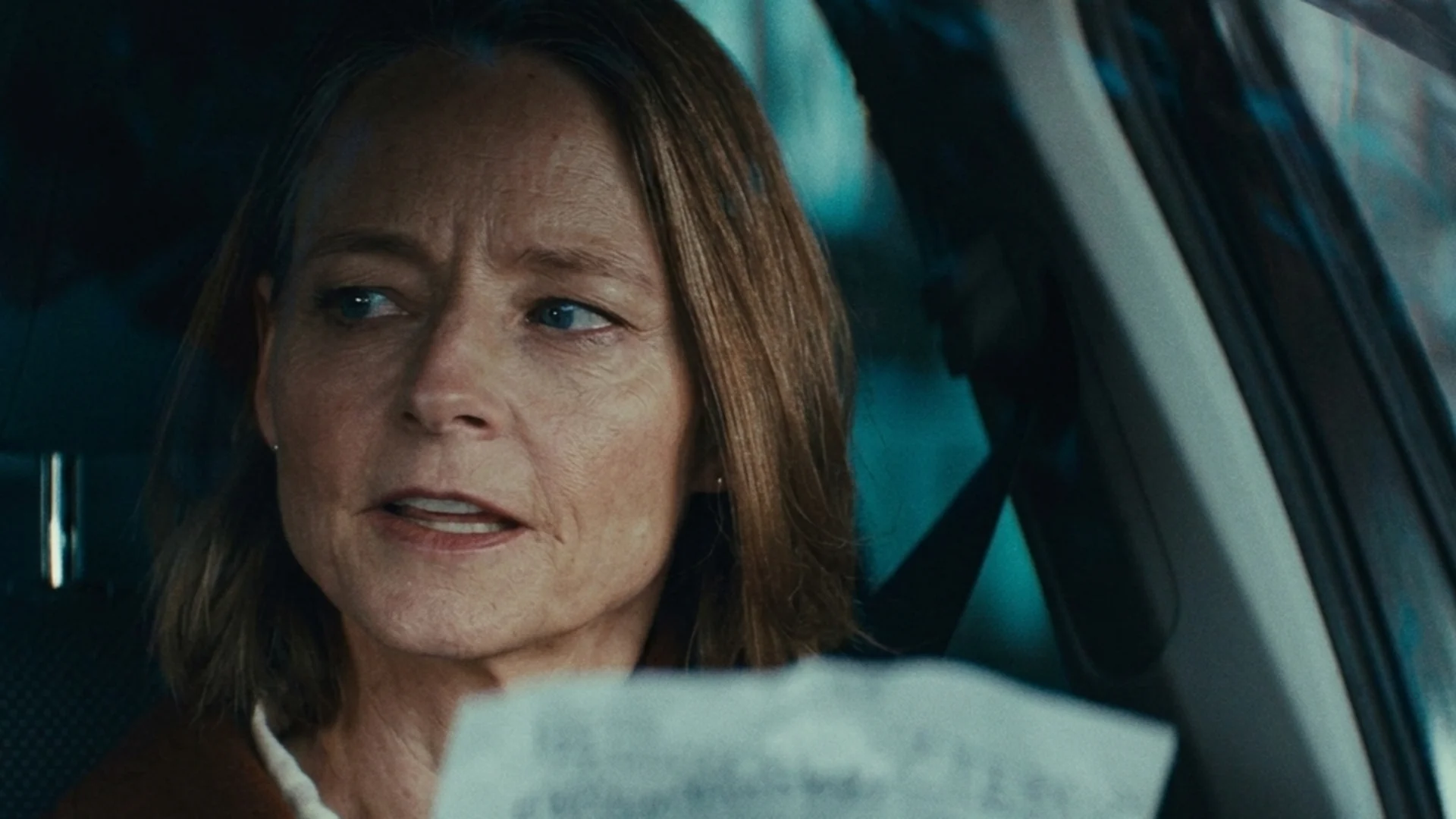 Jodie Foster as Lilian Steiner in a car with a document in A Private Life