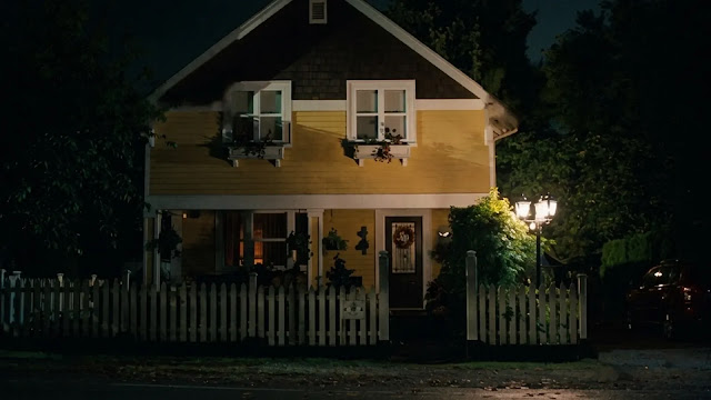 A suburban house exterior at night