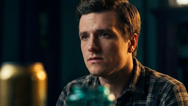 Josh Hutcherson as Mike sits tense in a dim room in the Five Nights at Freddy's 2 trailer