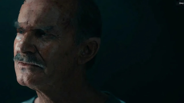 Hal Jordan (Kyle Chandler) in a dimly lit scene in Lanterns