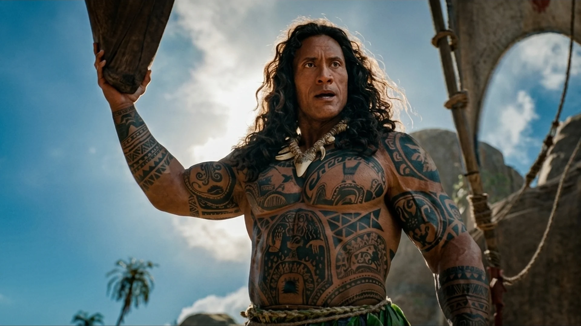 Dwayne Johnson as Maui raising his hook in the live-action Moana trailer