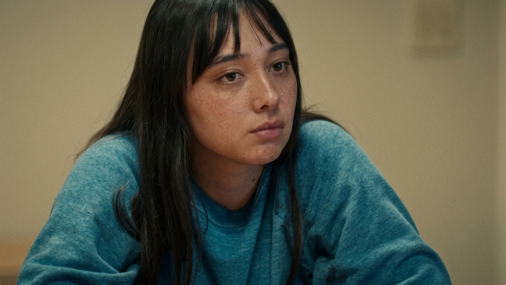 Sophia Maddox, in a blue sweater, sits for an interview looking off to one side