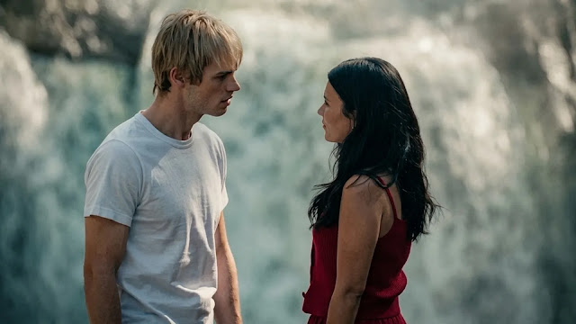 Jackie and Cole stand face to face by a waterfall in My Life with the Walter Boys Season 3.