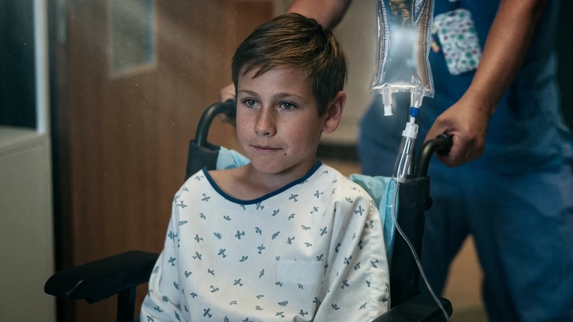 Noa is wheeled through the pediatric ward in Netflix's Nothing to Lose