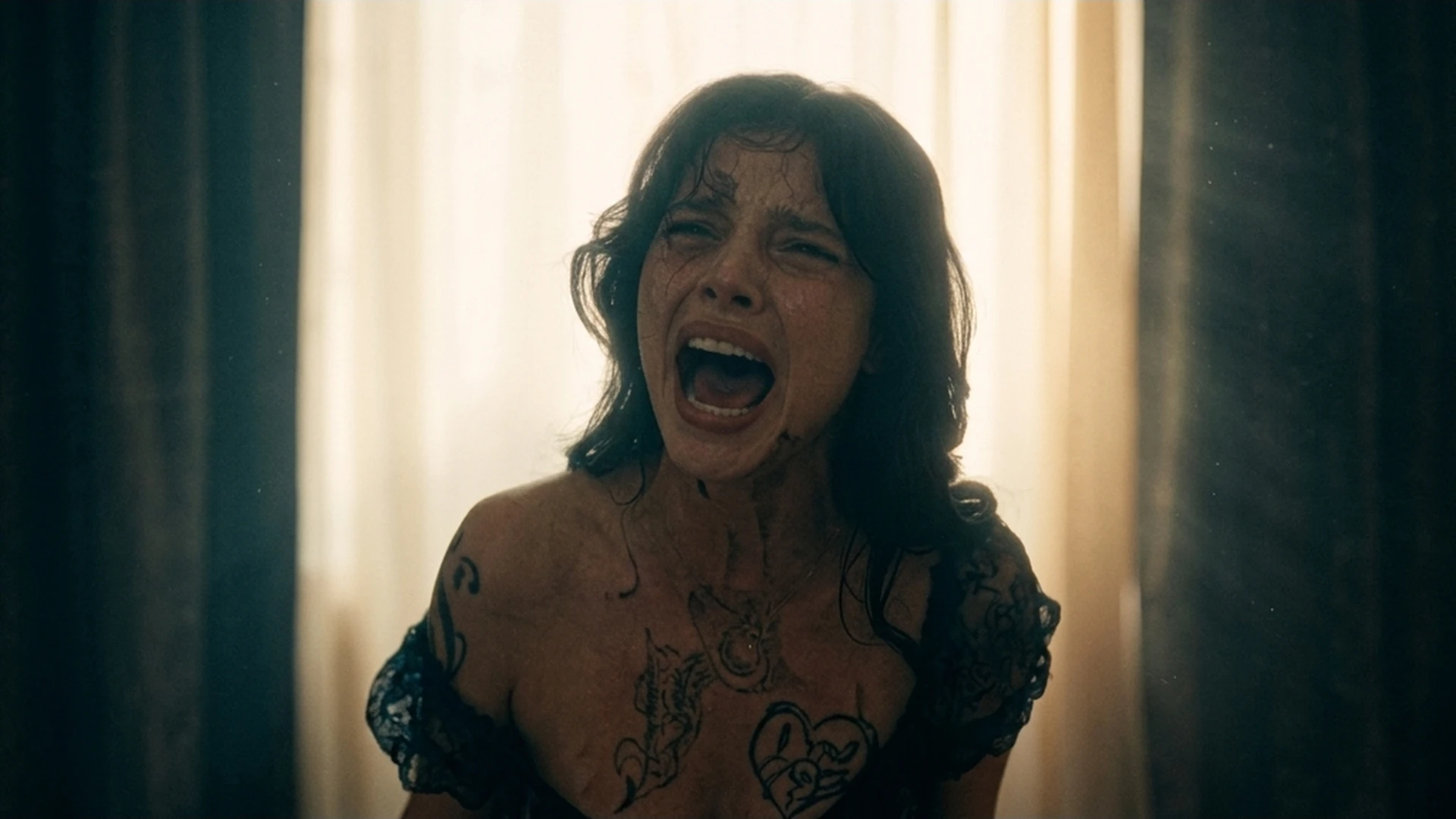 A woman screaming, backlit against a bright window, in the Obsession trailer