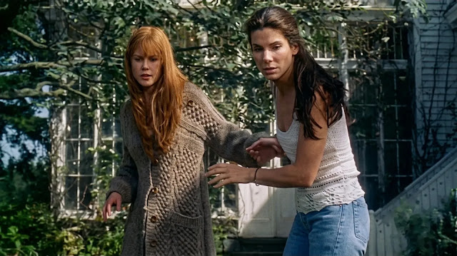 A young Gillian (Nicole Kidman) and Sally (Sandra Bullock) outside the Owens house in Practical Magic