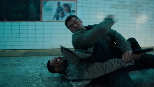 Jack Reacher pinning an attacker to the ground in a subway station in Reacher Season 4