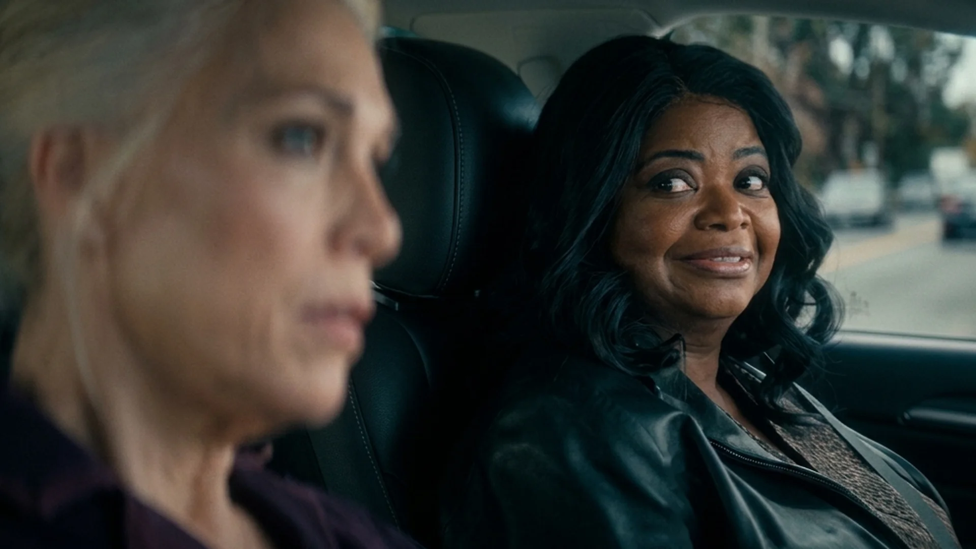 Debbie (Octavia Spencer) smiles at Judith (Hannah Waddingham) as they ride together in a car