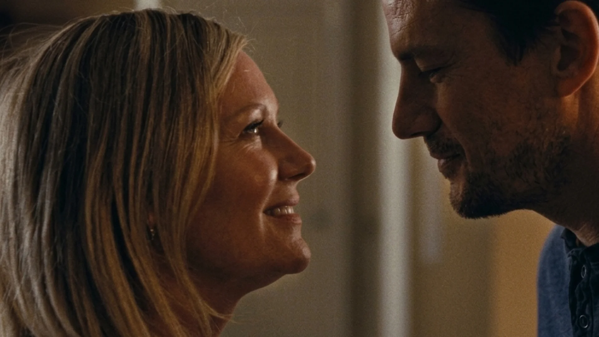 Channing Tatum as Manchester and Kirsten Dunst as Leigh smile face to face in Roofman