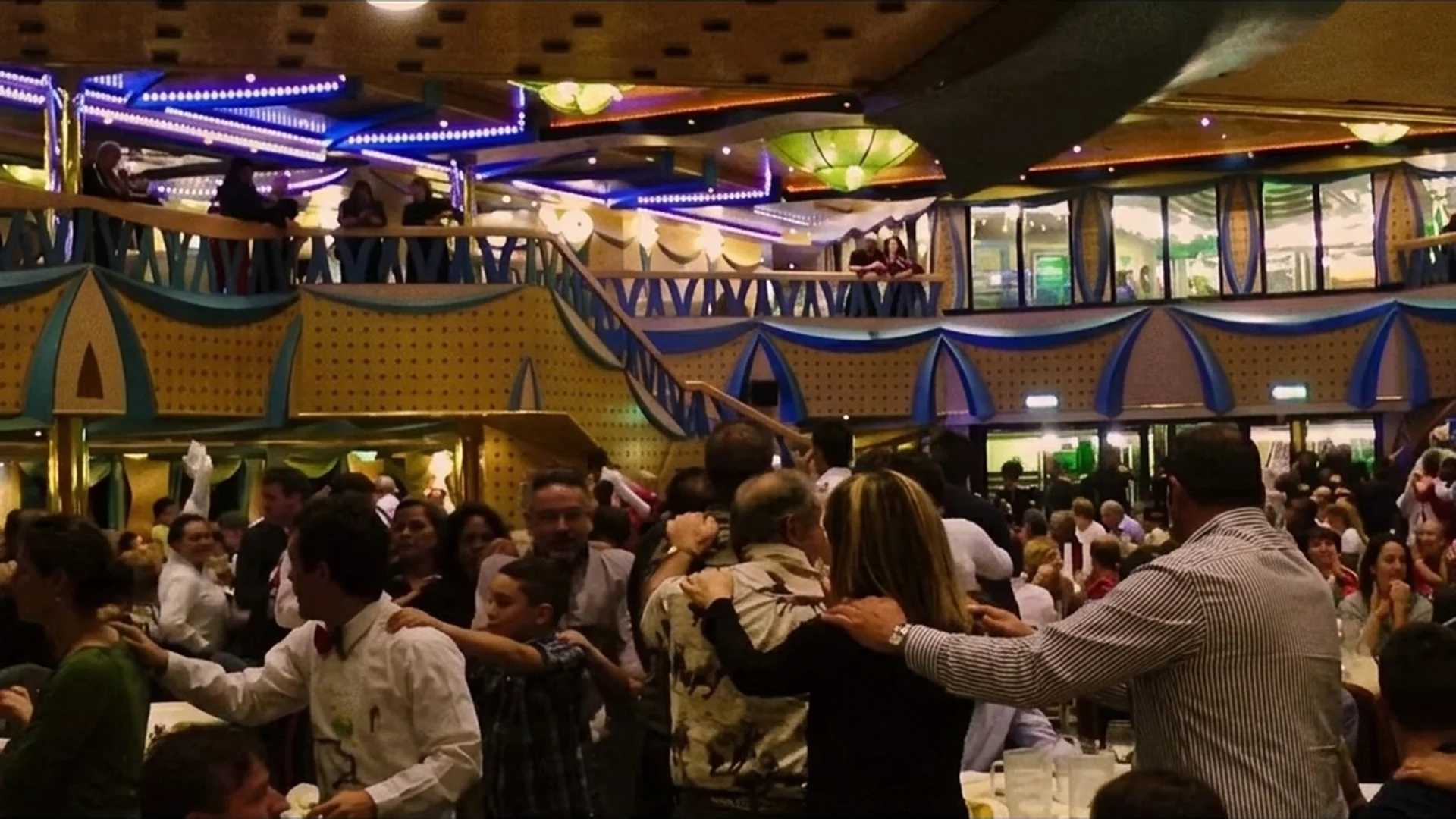 Passengers dance in the Costa Concordia's grand dining hall in archival footage from Shipwrecked: Nightmare at Sea