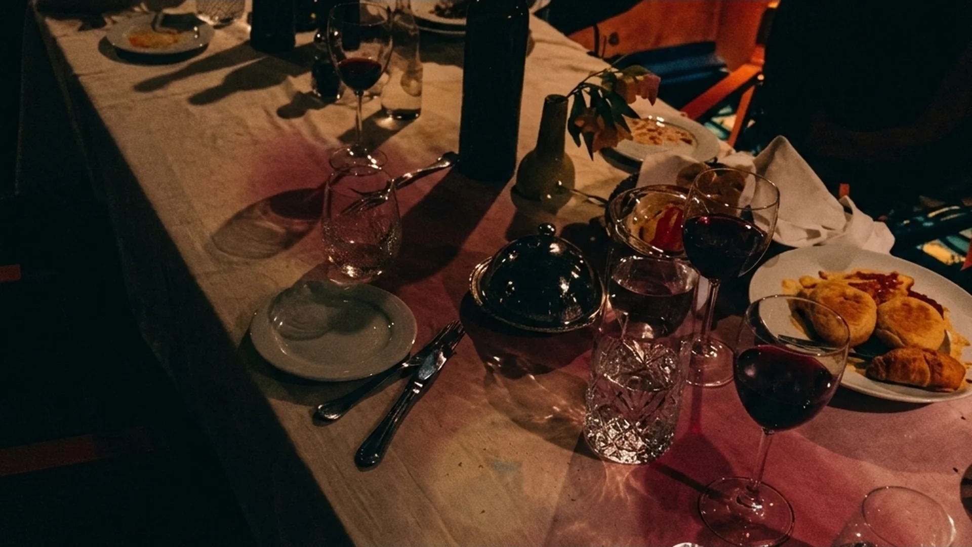 Wine glasses and plates left behind on a dinner table aboard the sinking Costa Concordia in Shipwrecked: Nightmare at Sea