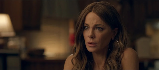 Maureen (Kate Beckinsale), a mother searching for her abducted daughter, in Stolen Girl
