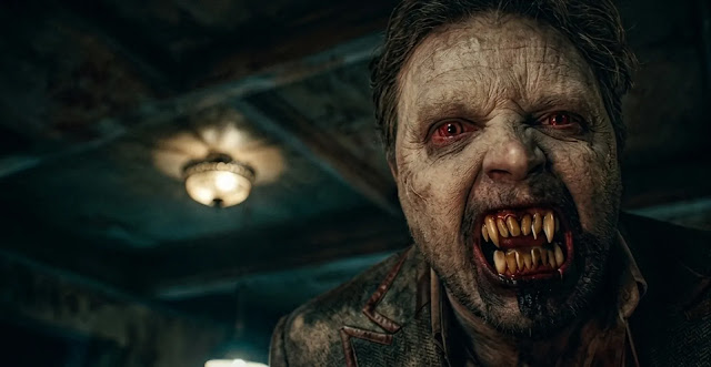 A vampire snarling with bared fangs in Talamasca: The Secret Order