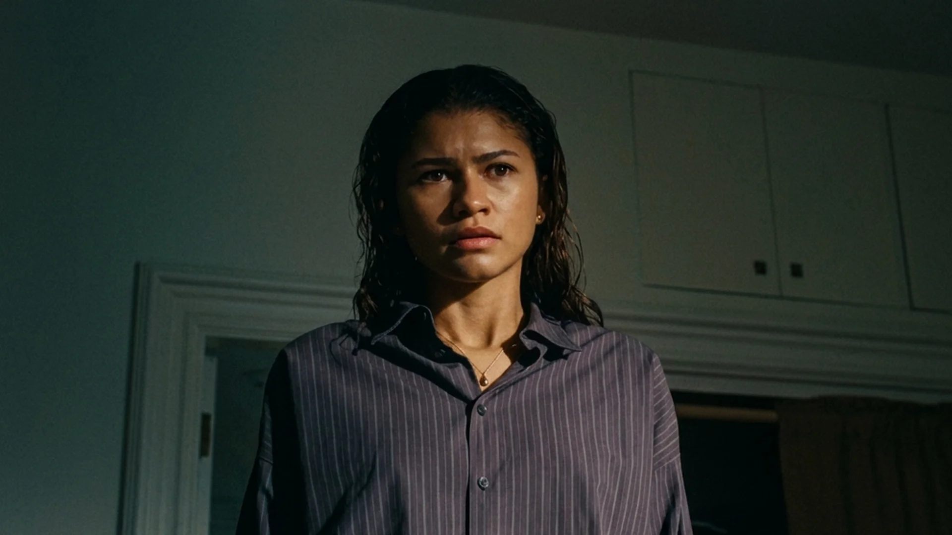 Zendaya as Emma in a dim kitchen in The Drama, facing forward