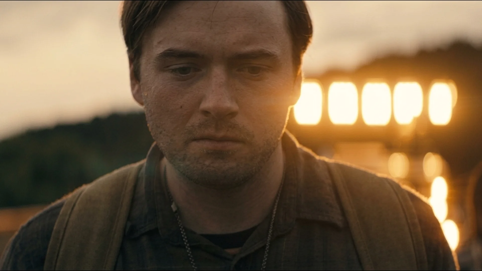 Cooper Hoffman as Ray Garraty under floodlights at night in The Long Walk