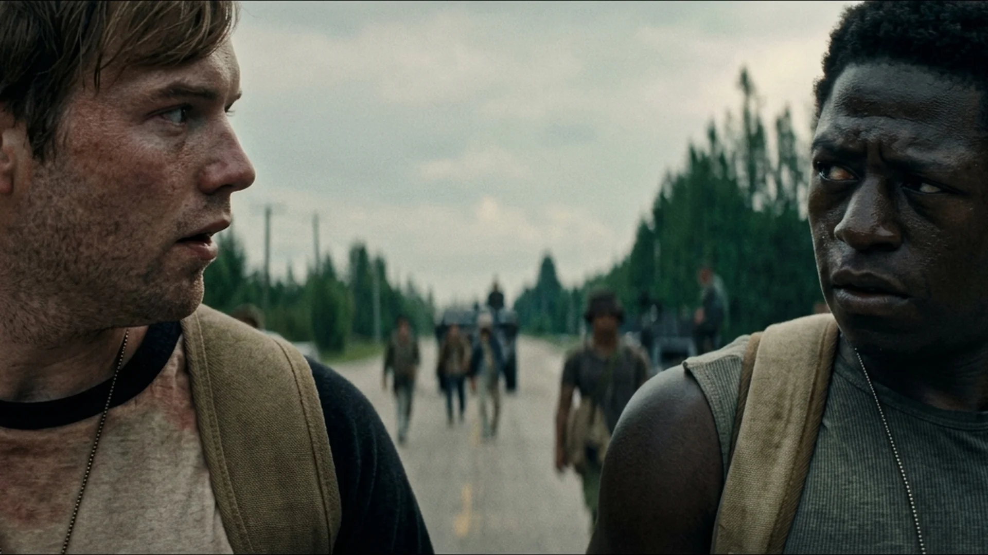 Ray Garraty and Peter McVries look back down the road together in The Long Walk