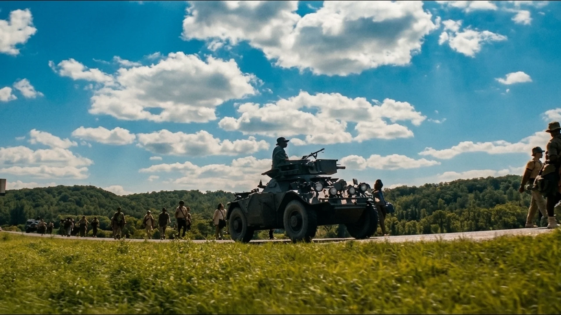 An armored vehicle with a mounted gun escorts the walkers in The Long Walk