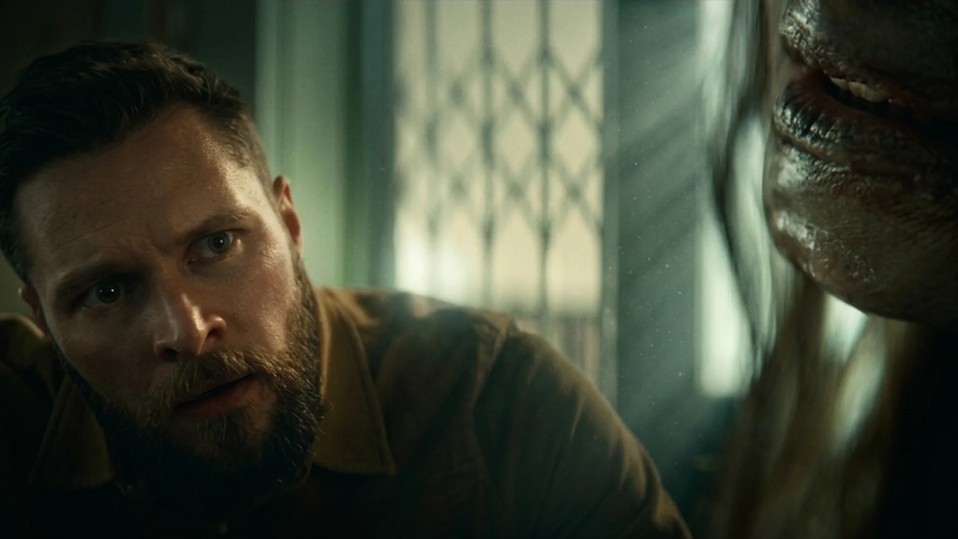 Charlie comes face to face with a decayed, mummified figure lying beside him in Lee Cronin's The Mummy