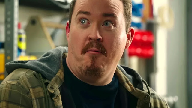 Shane Gillis as Shane, wide-eyed, in the Valley Forge shop in Tires Season 3